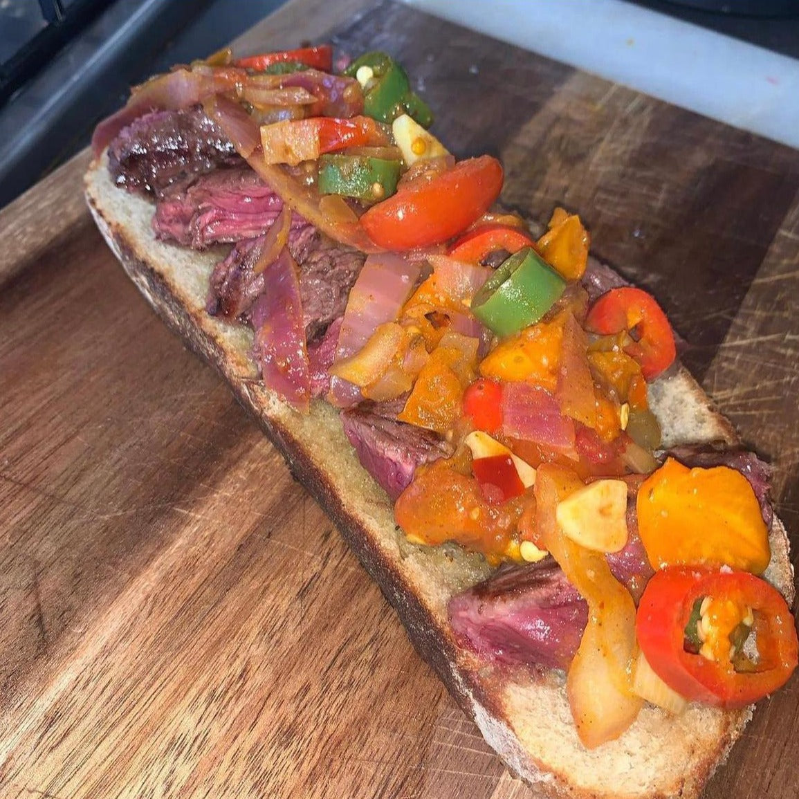 A steak and vegetable sandwich flavoured with Moruga Fire