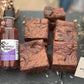 A picture of a bottle of Cherry Berry Reaper next to some chocolate chilli brownies made with Cherry Berry Reaper