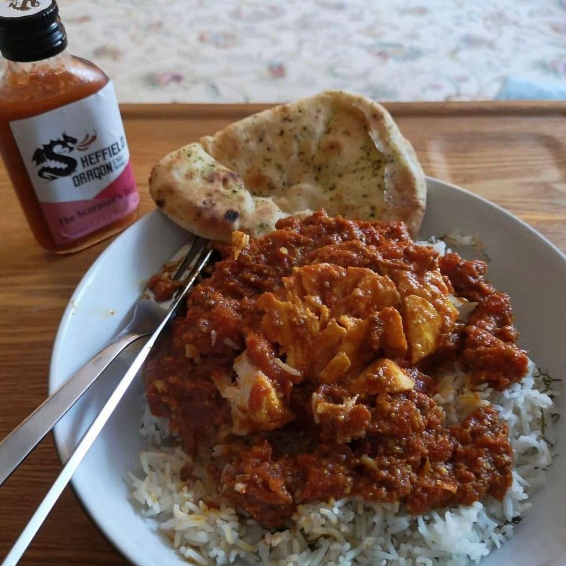 A picture of a fish curry meal flavoured with The Scorpion's Tale hot sauce